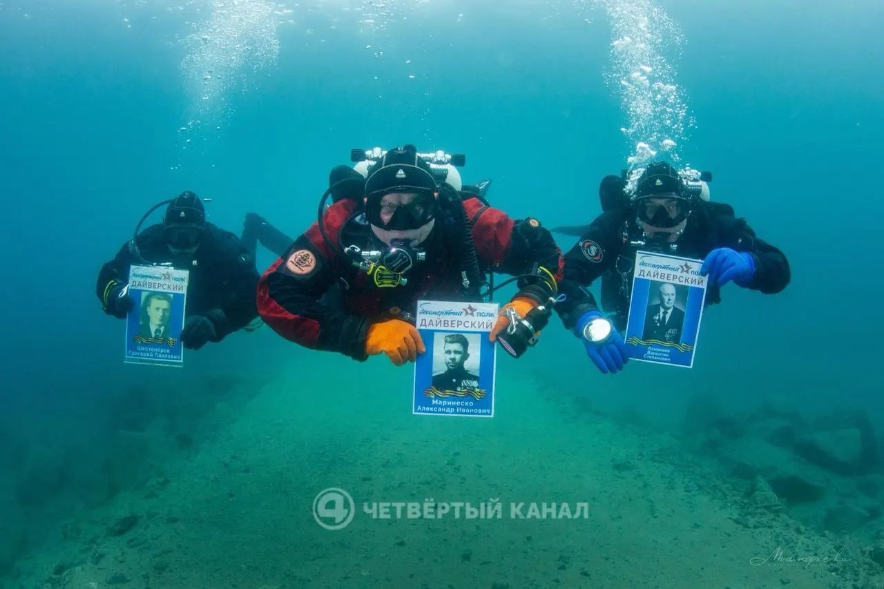 В карьере Лазурный 21 участник прошёл под водой с портретами ветеранов ко Дню Победы; погружение длилось 55 минут на глубине до 27 метров.